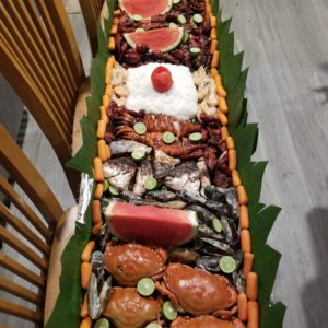 Boodle fight tray seafood and bbq
